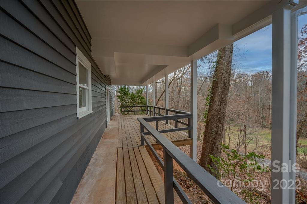 241 Hidden Hill Road Tryon, NC 28782 - Photo 32 of 39 a view of balcony with wooden floor and fence