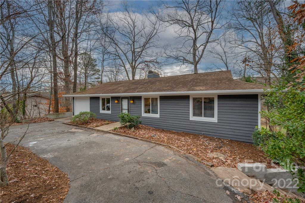 241 Hidden Hill Road Tryon, NC 28782 - Photo 38 of 39 a front view of a house with garden