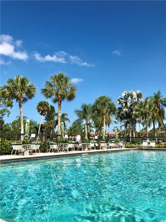 4345 27th Court Southwest, Unit 202 Naples, FL 34116 - Photo 20 of 26 a view of a palm trees