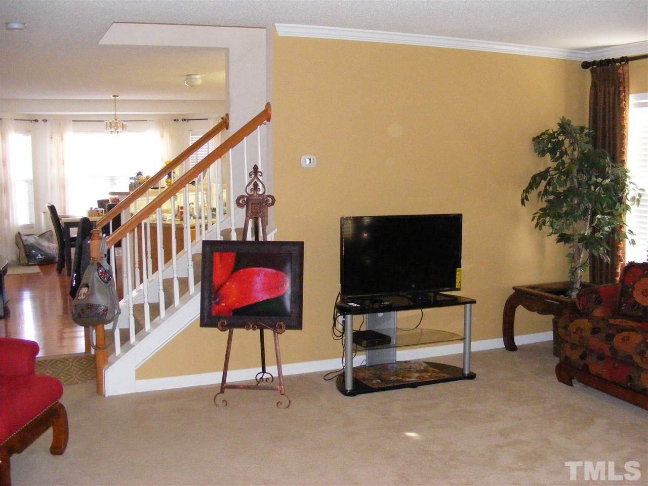 2516 Quarry Ridge Lane Raleigh, NC 27610 - Photo 2 of 10 a living room with furniture and a flat screen tv