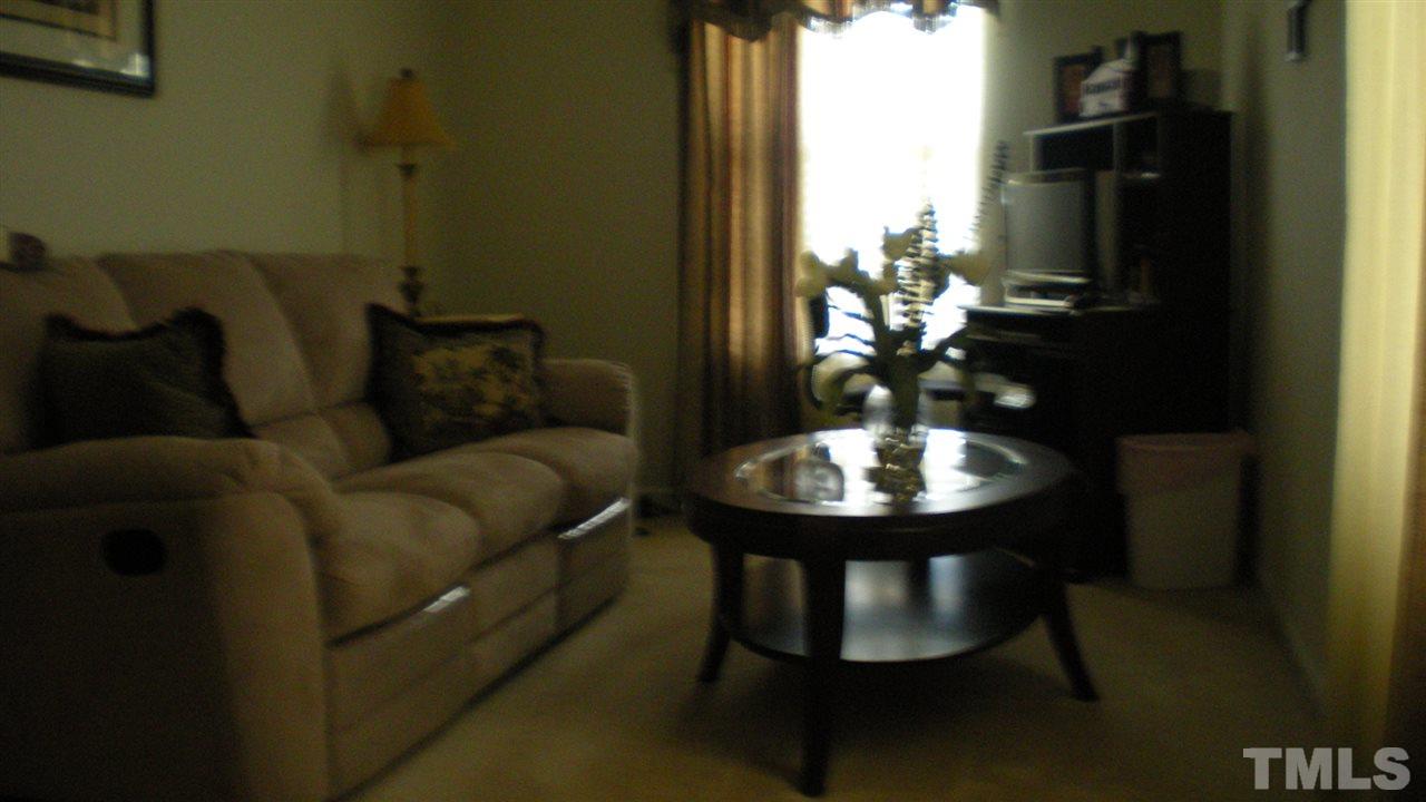 2516 Quarry Ridge Lane Raleigh, NC 27610 - Photo 3 of 10 a living room with furniture and a mirror