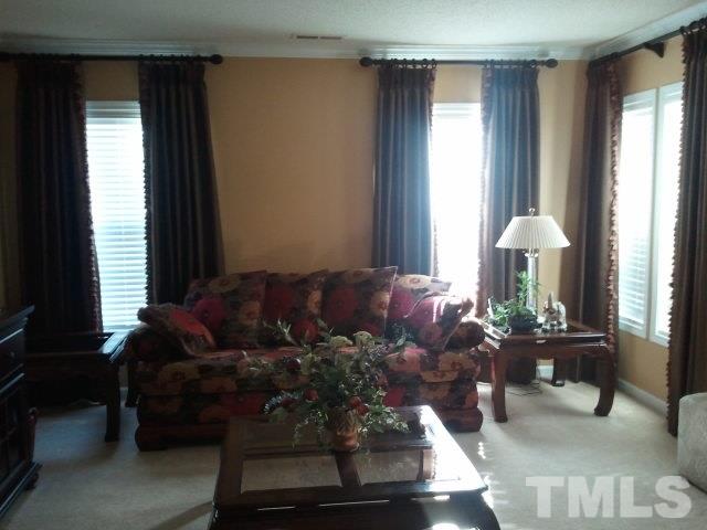 2516 Quarry Ridge Lane Raleigh, NC 27610 - Photo 4 of 10 a living room with furniture and a window