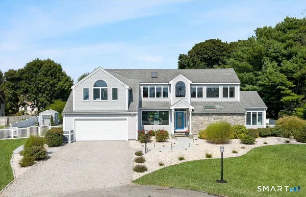 a aerial view of a house with a yard