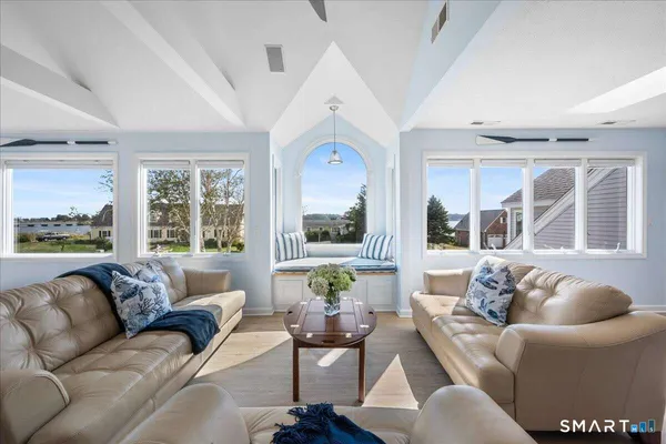 a living room with furniture and a large window
