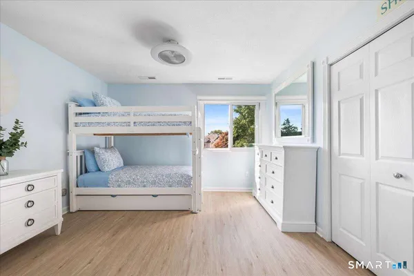 a bedroom with a bed and a dresser