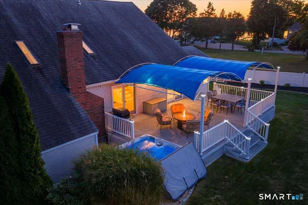 an aerial view of a house with garden space and street view