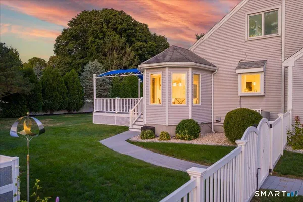 a front view of a house with garden
