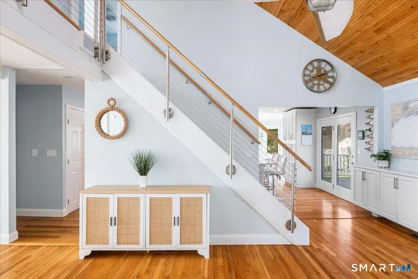 a view of entryway with wooden floor