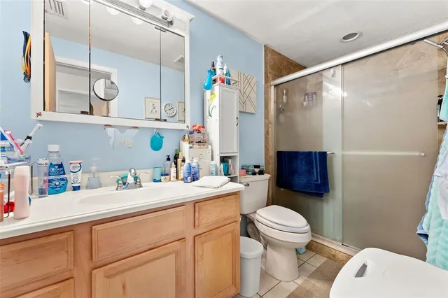 a bedroom with furniture and a flat screen tv