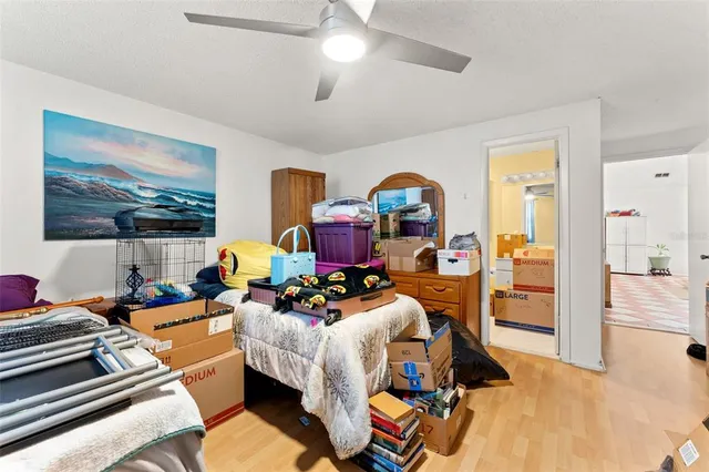 a bathroom with a granite countertop toilet sink and mirror