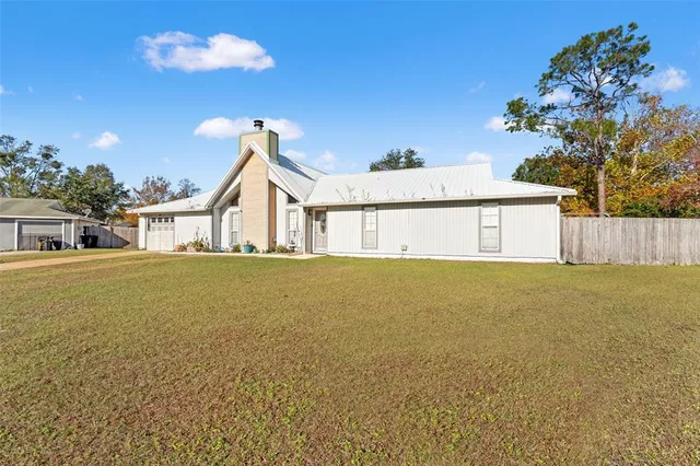 a bedroom with furniture and a flat screen tv