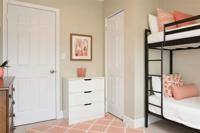 a bedroom with a bed and a cabinets