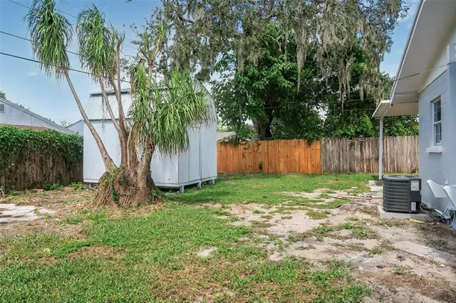 a backyard of a house with lots of green space