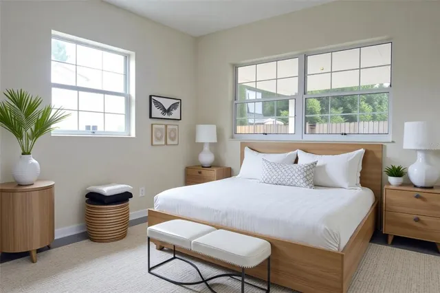 a bed room with a bed and a chair