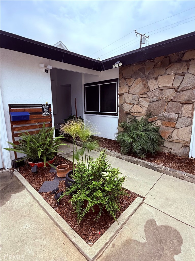 19303 Kemp Avenue Carson, CA 90746 - Photo 3 of 13 a front view of a house with garden