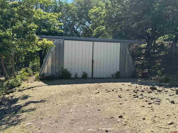 a view of a backyard of a house