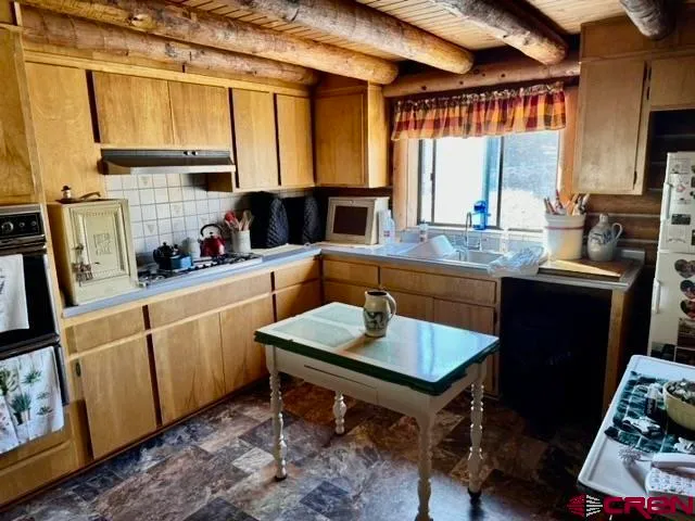 a view of living room filled with furniture and window