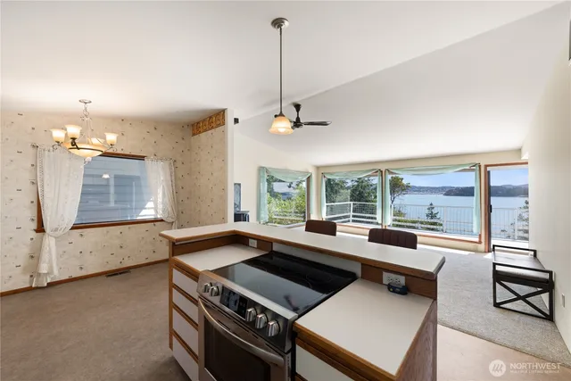 a kitchen with a stove a sink and a refrigerator