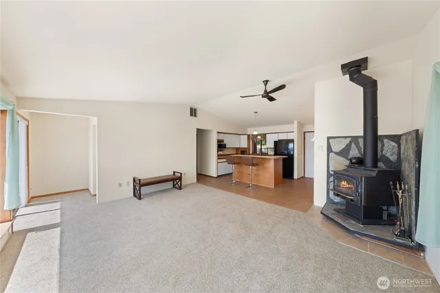 a view of a livingroom with furniture and a flat screen tv