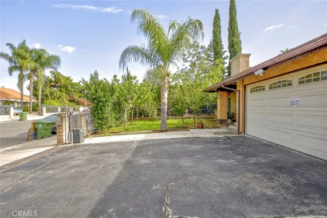 a view of a house with a yard and plant