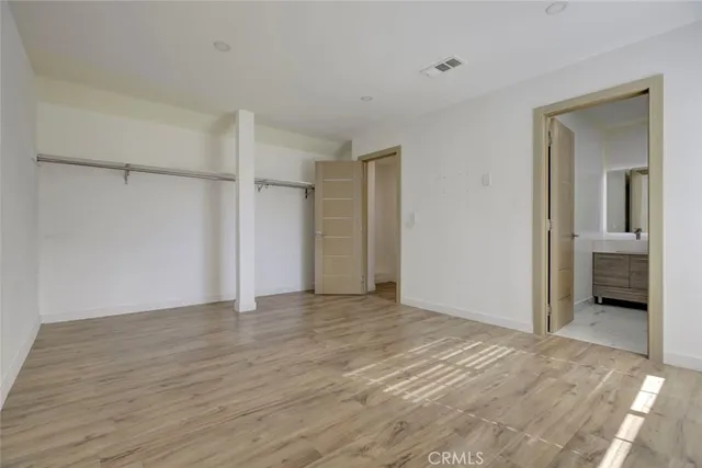 a view of an empty room with a closet