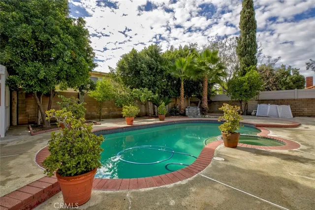 a view of a garden with a fountain