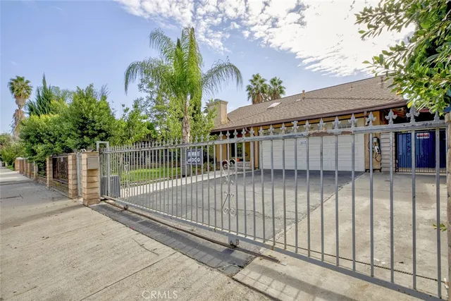 a view of a wrought iron fences in front of house