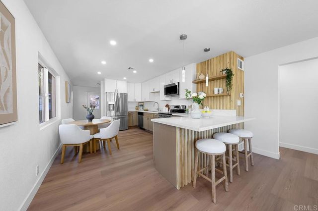 a bedroom with a bed and a potted plant