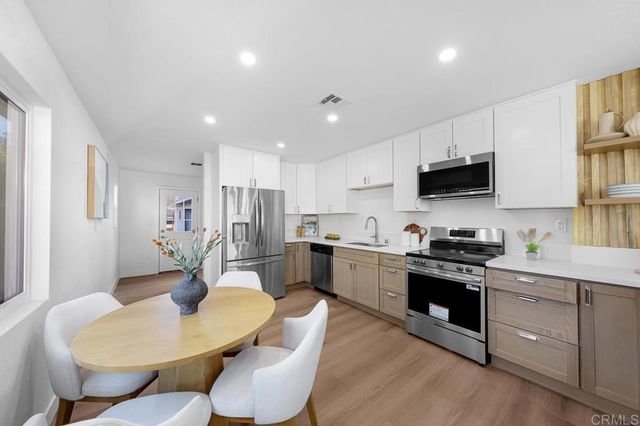 a bedroom with a bed and a potted plant