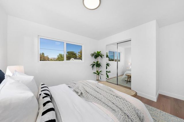 a bedroom with a bed and a cabinets