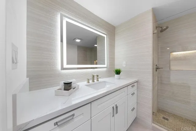 a bedroom with a bed and a lamp