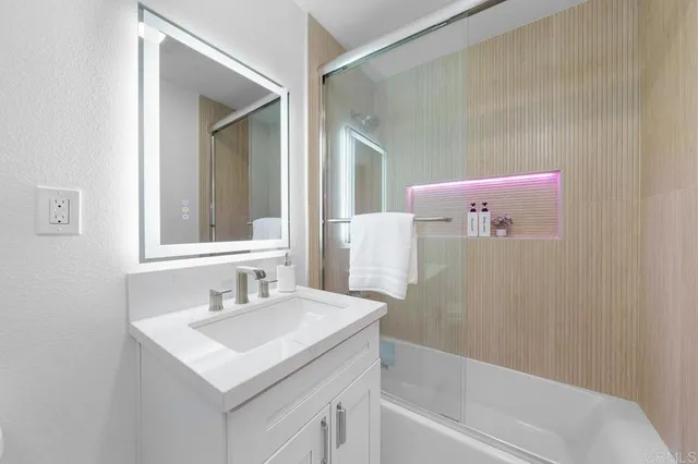 a view of a room with wooden floor and white walls