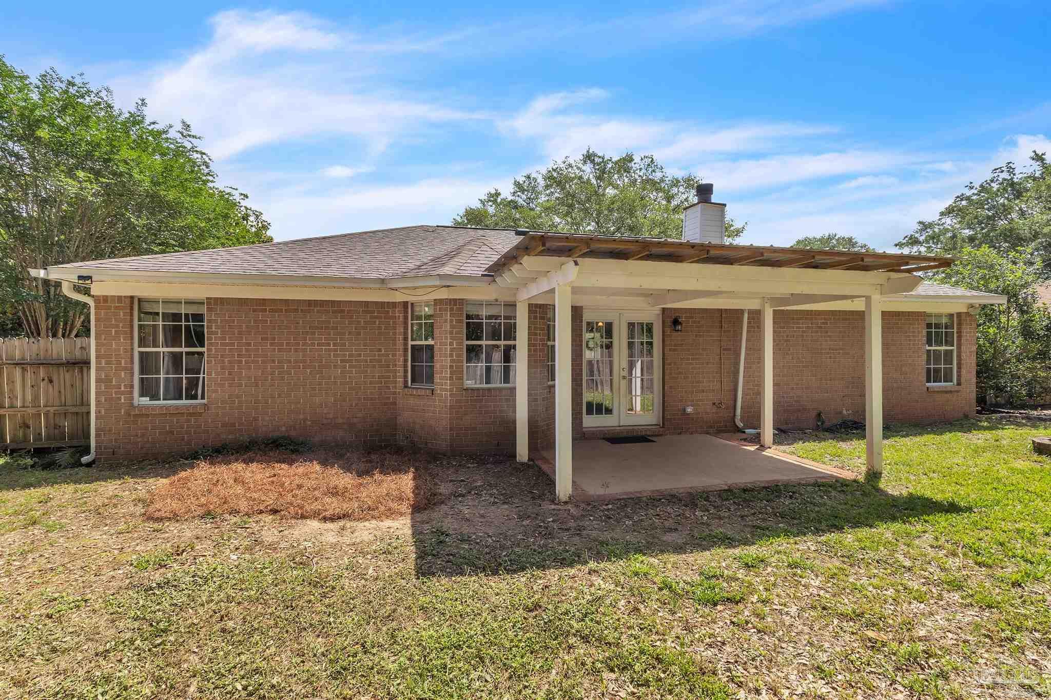 4321 Ridgeland Drive Pace, FL 32571 - Photo 35 of 36 front view of a house with a yard