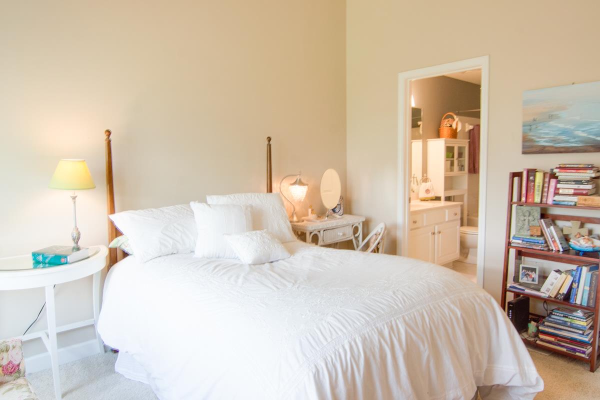 3535 Bell Road, Unit 705 Nashville, TN 37214 - Photo 14 of 20 a bedroom with a bed and a book shelf