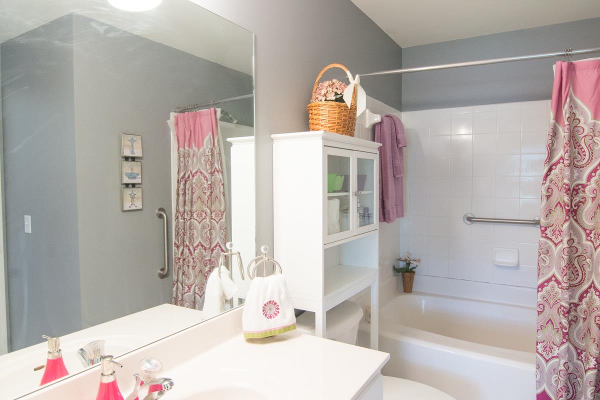 3535 Bell Road, Unit 705 Nashville, TN 37214 - Photo 15 of 20 a bedroom with a bed and a table in it