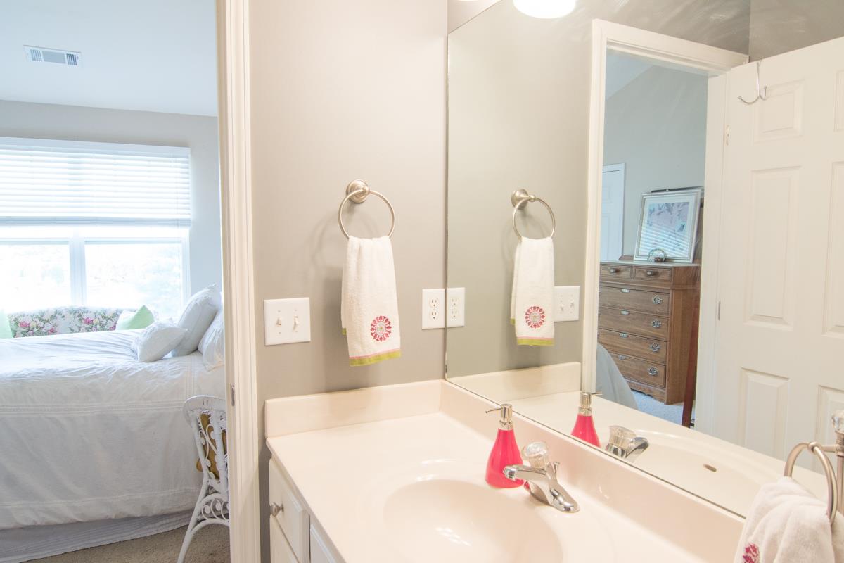 3535 Bell Road, Unit 705 Nashville, TN 37214 - Photo 16 of 20 a bath room with a bed and a dresser
