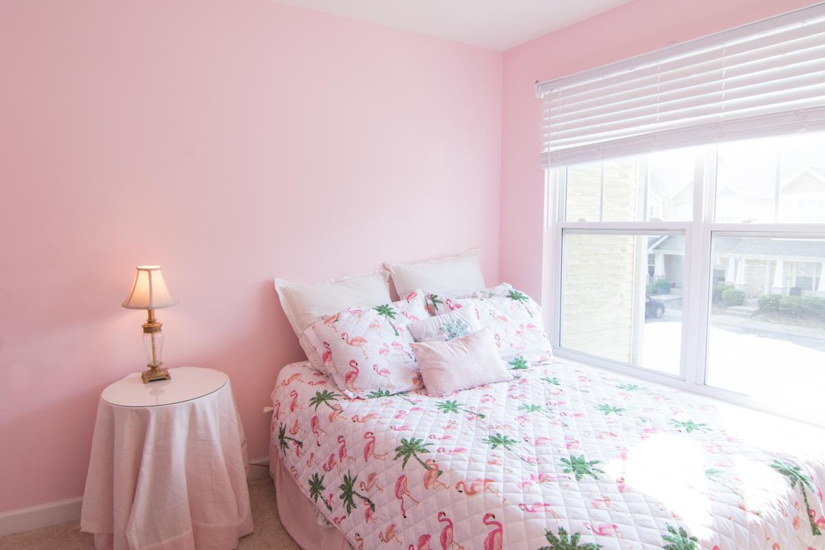 3535 Bell Road, Unit 705 Nashville, TN 37214 - Photo 17 of 20 a large bed sitting in a bedroom next to a window