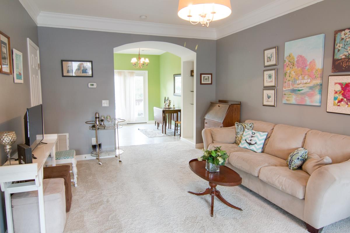 3535 Bell Road, Unit 705 Nashville, TN 37214 - Photo 4 of 20 a living room with furniture and a chandelier
