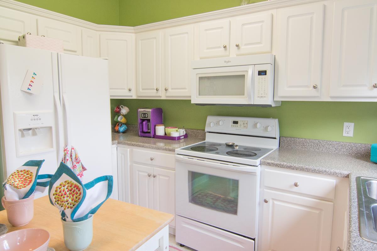 3535 Bell Road, Unit 705 Nashville, TN 37214 - Photo 10 of 20 a kitchen with white cabinets and white appliances
