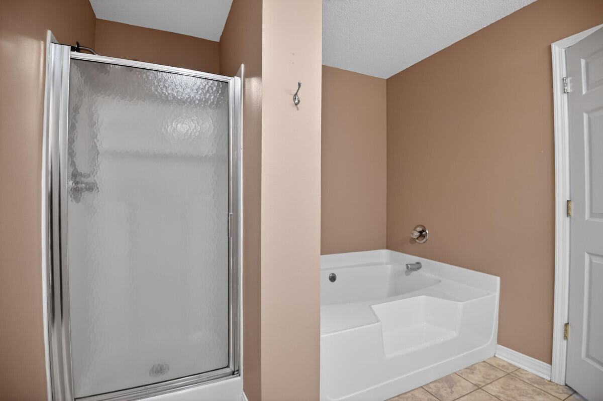 4654 Sunsail Circle Destin, FL 32541 - Photo 14 of 22 a bathroom with a bathtub and shower