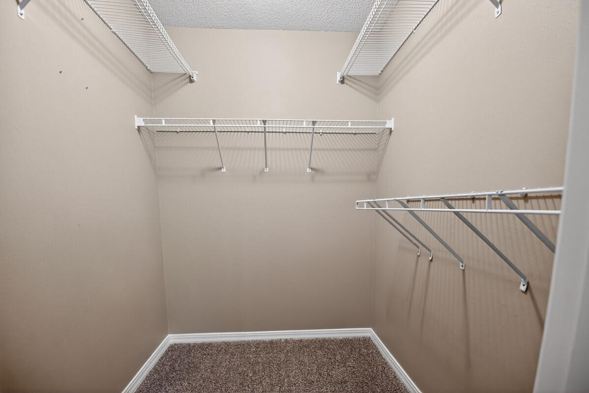 4654 Sunsail Circle Destin, FL 32541 - Photo 15 of 22 a view of storage and utility room with racks on the wall