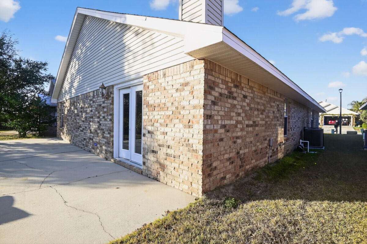 4654 Sunsail Circle Destin, FL 32541 - Photo 21 of 22 a view of a house with a yard