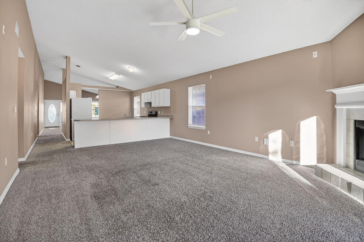 4654 Sunsail Circle Destin, FL 32541 - Photo 8 of 22 a view of a kitchen with a sink and a refrigerator