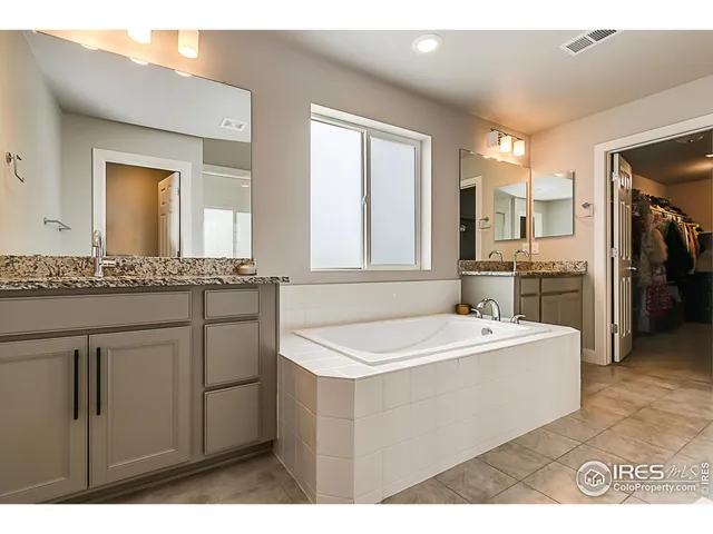 a bathroom with a sink a mirror and a bathtub