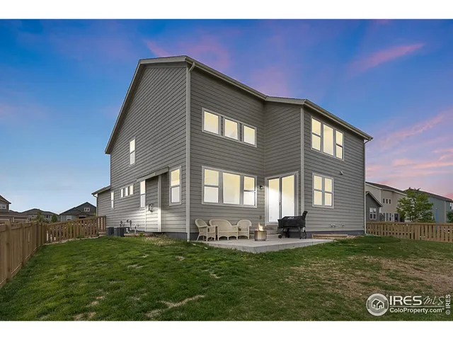 a front view of building with yard