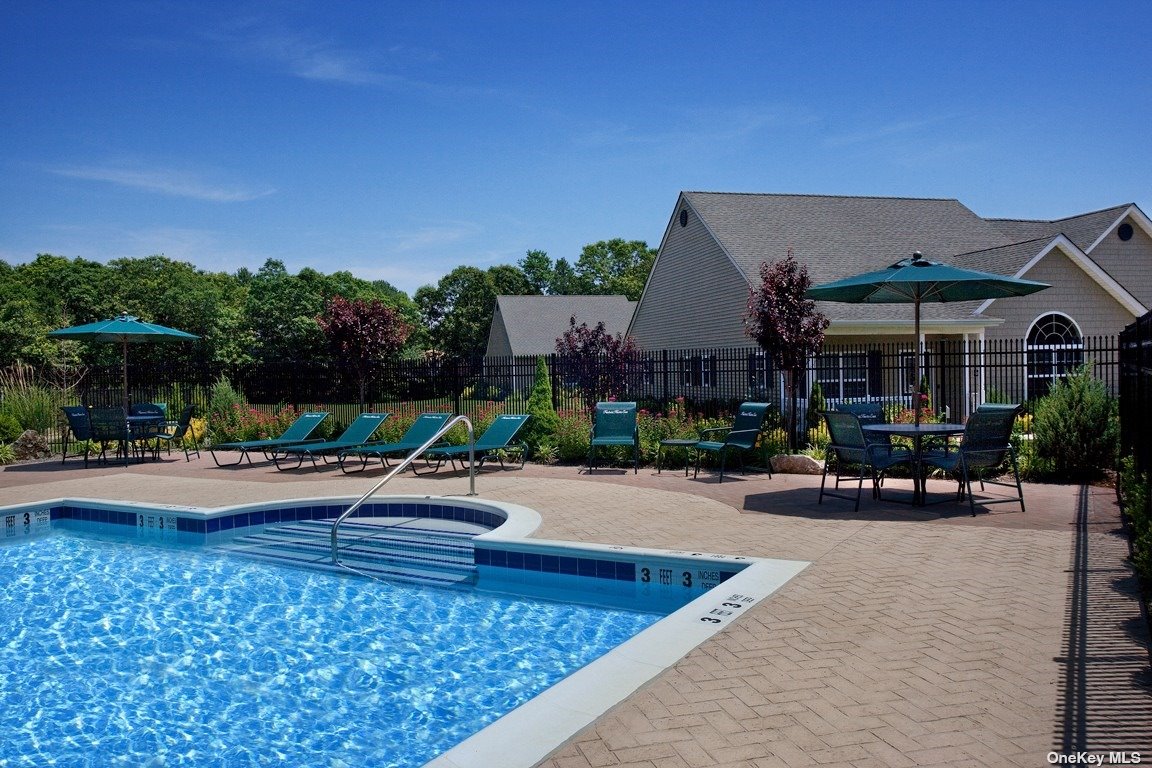 a view of house with outdoor space and swimming pool
