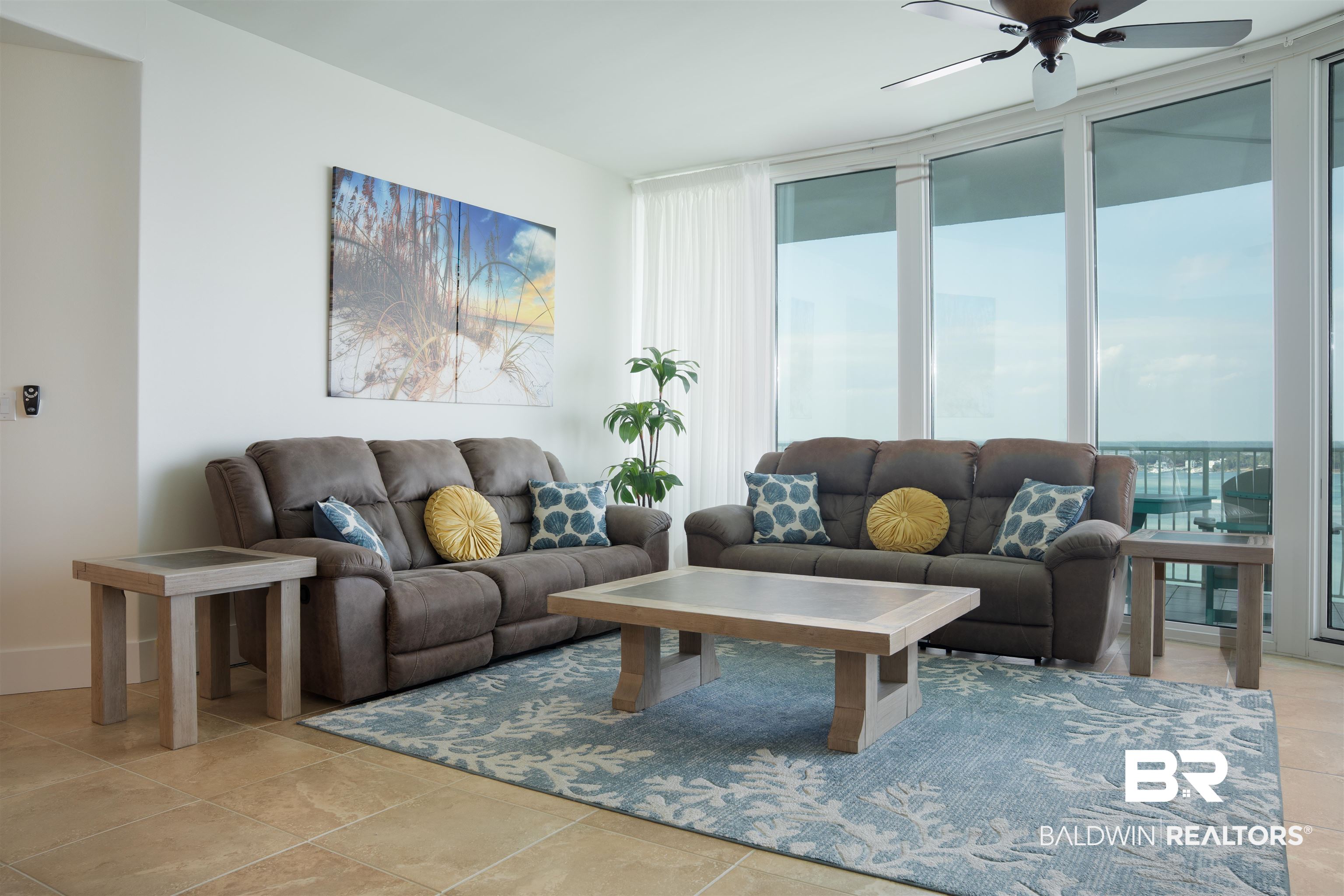28107 Perdido Beach Boulevard, Unit DPH05 Orange Beach, AL 36561 - Photo 3 of 43 Living area with a ceiling fan and expansive windows