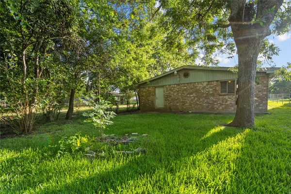 a backyard of a house with lots of green space
