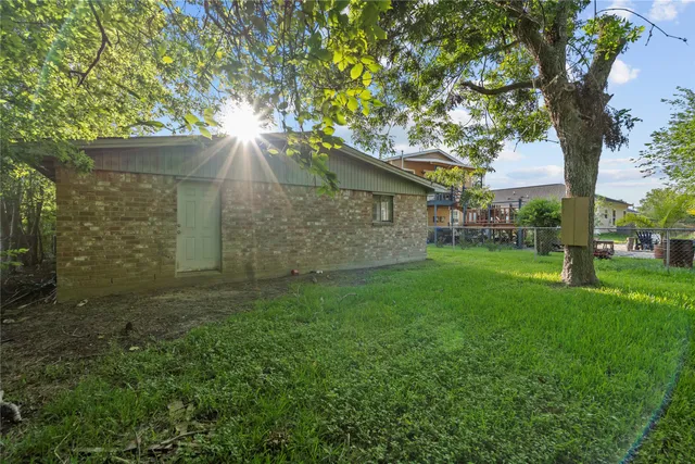 a view of a yard with a tree