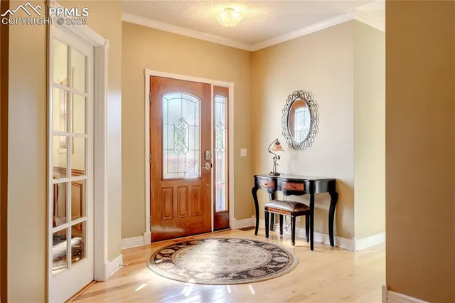 a kitchen with stainless steel appliances a sink stove and a window